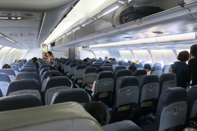 a group of people sitting in an airplane