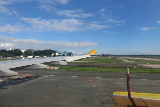 an airplane wing on a runway