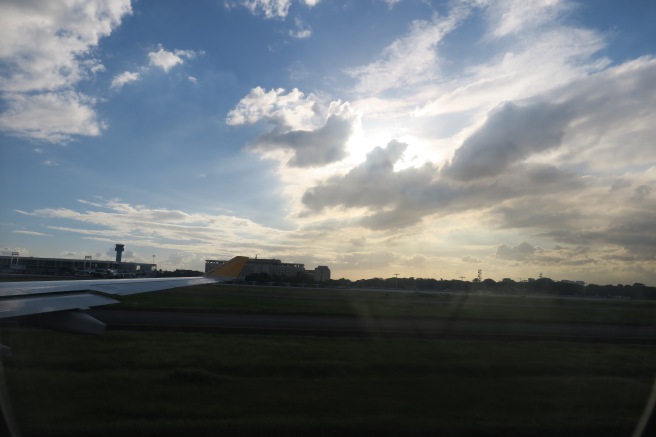 a plane wing on a runway