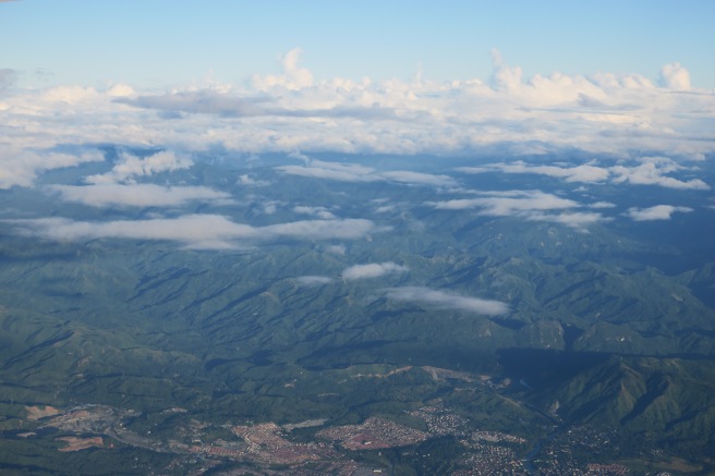 aerial view of a valley with clouds