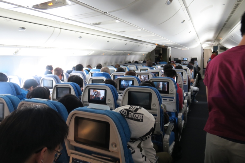 a group of people sitting in an airplane