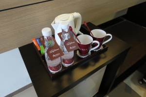 a tray with coffee cups and a teapot