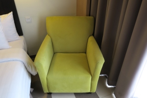 a green chair in a room