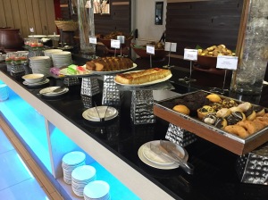 a buffet table with plates and food