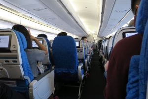 a group of people sitting in an airplane