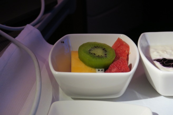 a bowl of fruit on a table