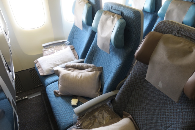 a seat with pillows on it