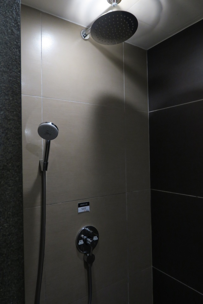 a shower head in a bathroom