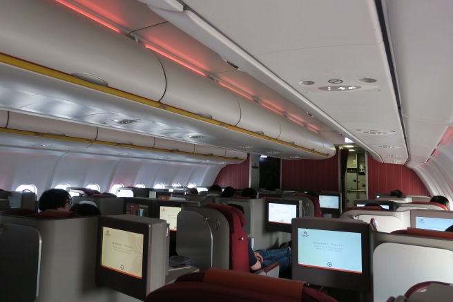 a group of people sitting in an airplane