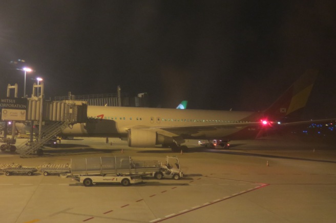 an airplane on the runway at night