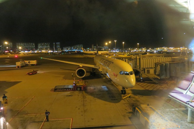 an airplane on the tarmac at night