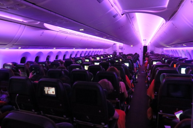 a group of people sitting in an airplane