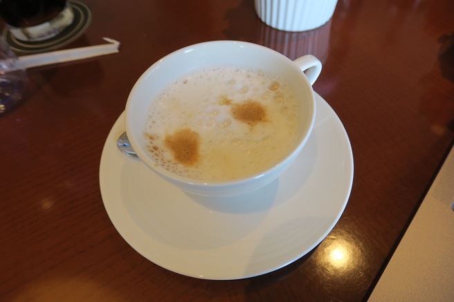 a cup of coffee on a saucer