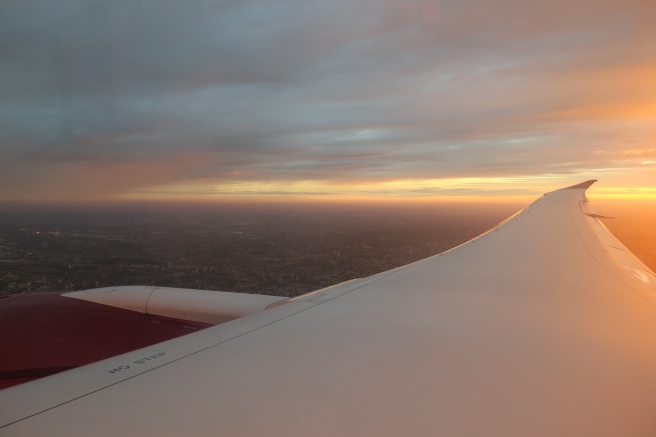 an airplane wing and sky