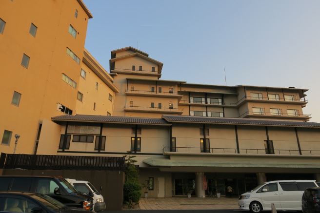 a building with cars parked in front of it