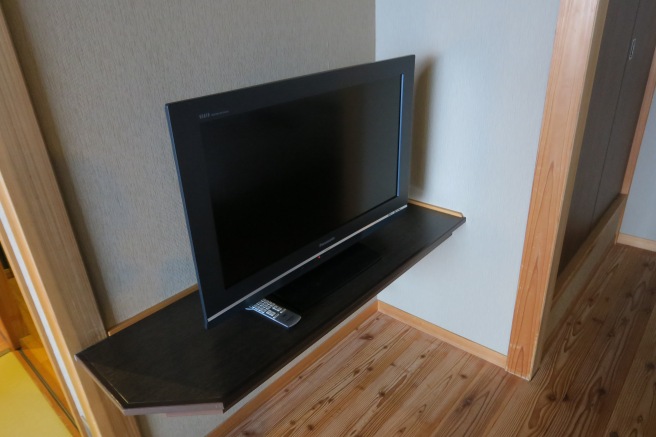 a tv on a shelf