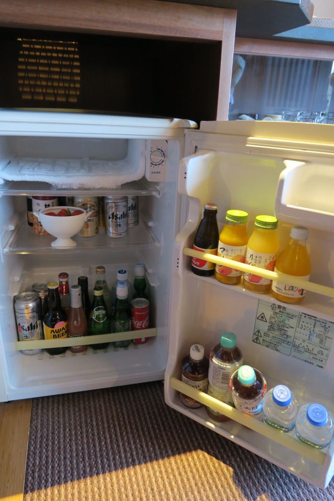 a refrigerator with drinks and beverages