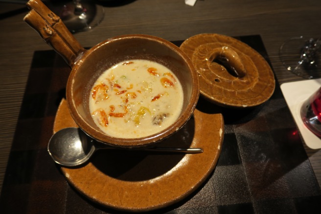 a bowl of soup on a plate