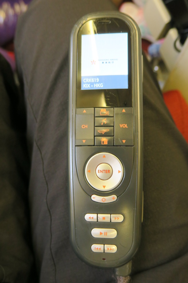 a remote control with buttons and a screen