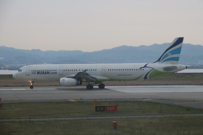 a white airplane on a runway