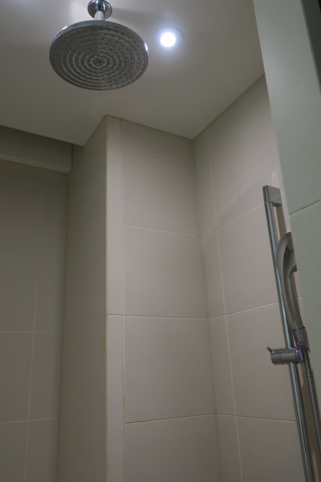 a shower head in a bathroom