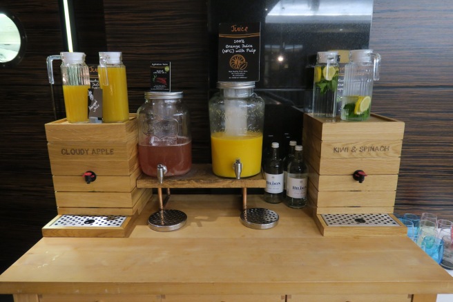 a group of juices and bottles on a table