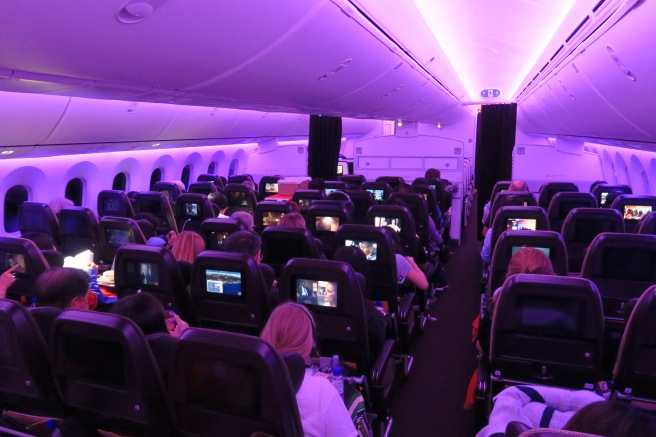 a group of people sitting in an airplane