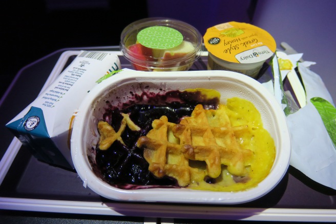 a food in a container on a tray