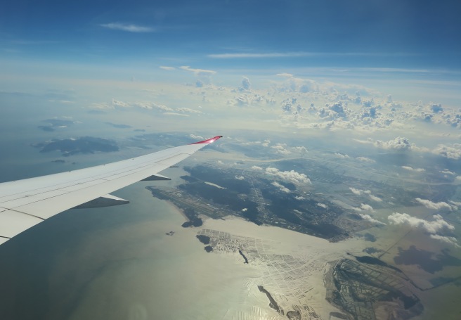 an airplane wing above land