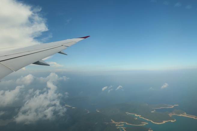 an airplane wing in the sky