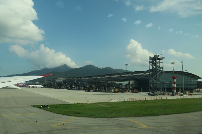 a building with a plane in the background