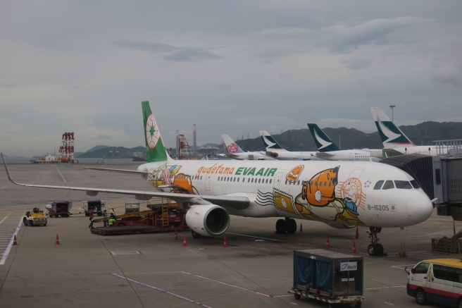 a group of airplanes on a runway