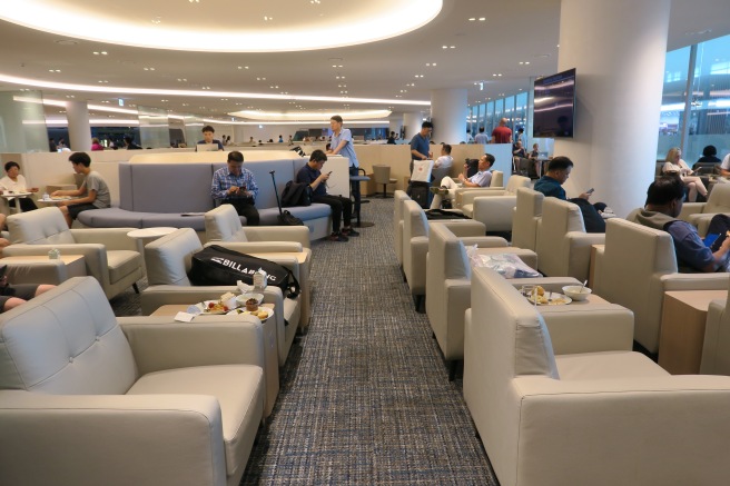 a group of people sitting in a lounge area