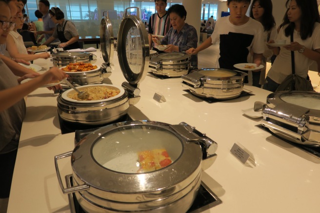 a group of people serving food