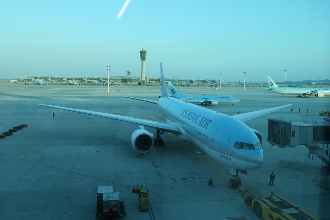 a group of airplanes on a runway