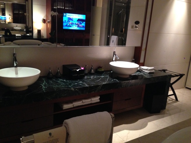 a bathroom with a large mirror and two sinks