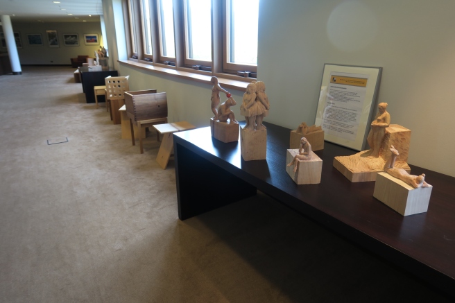 a group of wooden statues on a table