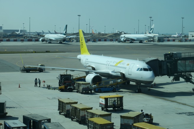 a group of airplanes at an airport