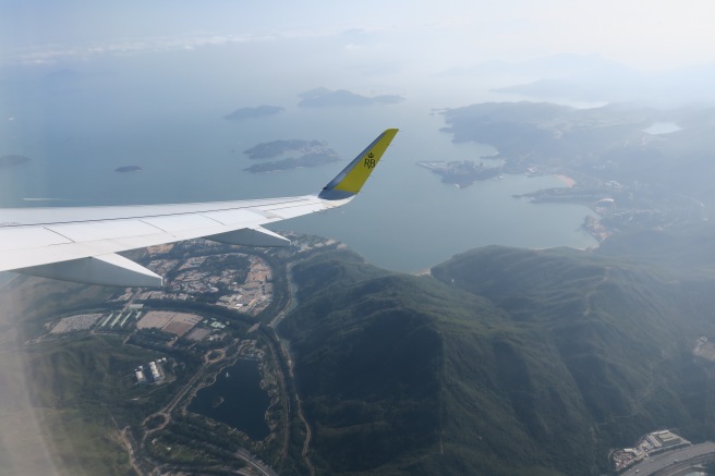 an airplane wing above land