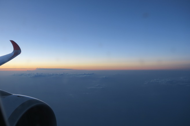 an airplane wing and the sky