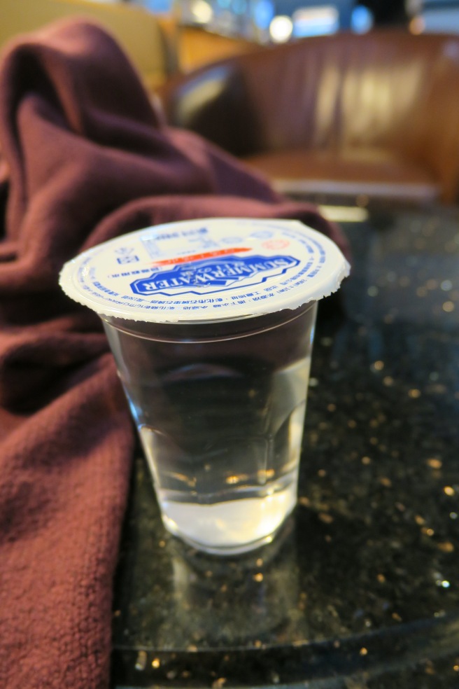 a cup of water on a table