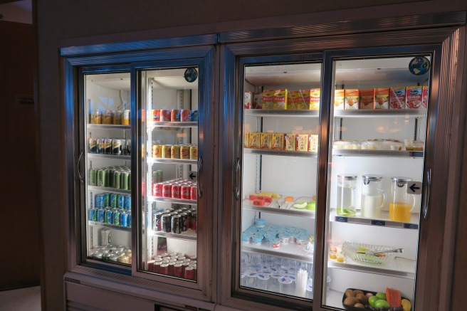 a refrigerator with drinks and beverages