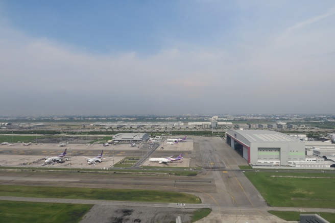 an airport with airplanes parked on the ground