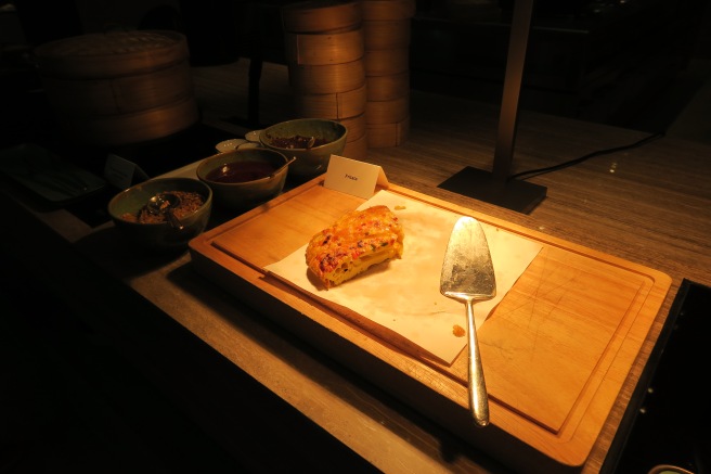 a pizza on a cutting board