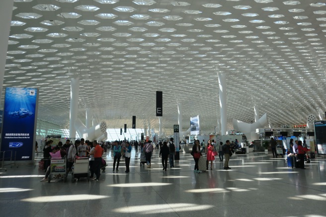 a group of people in a large airport