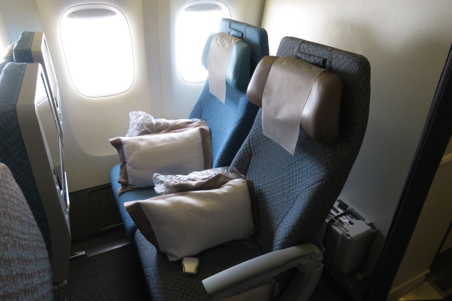 a seat with pillows on it