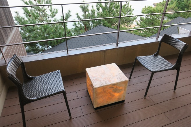 a chair and table on a deck