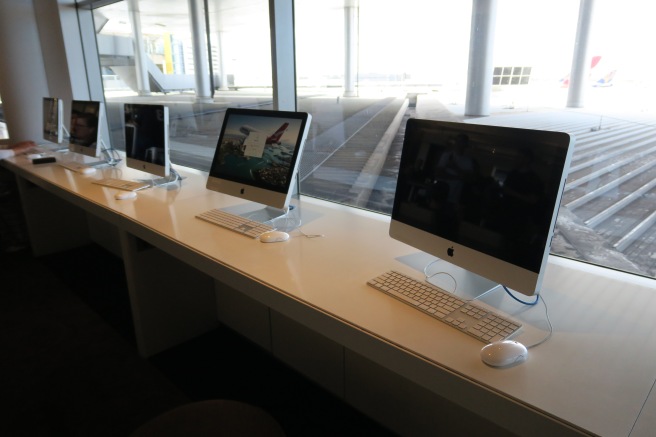 a row of computers on a table