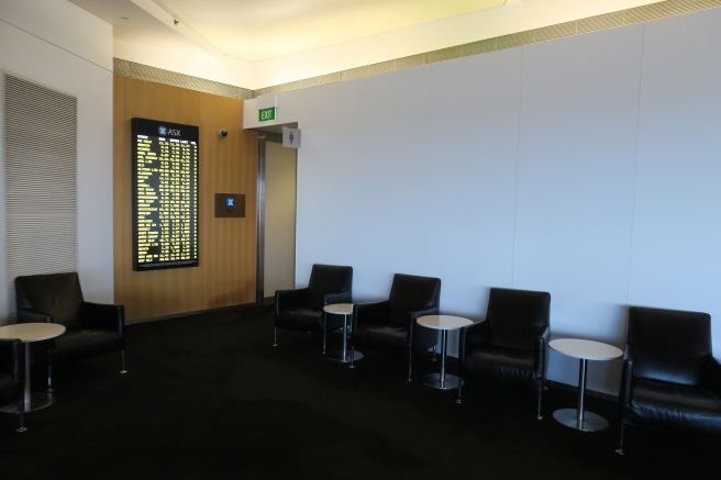 a row of chairs and tables in a waiting room