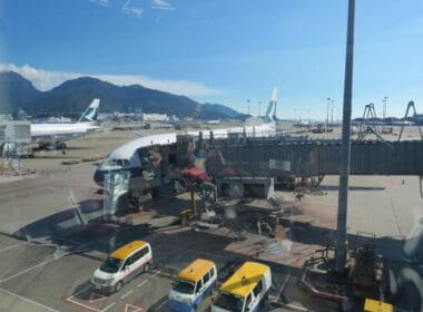 a plane and van at an airport